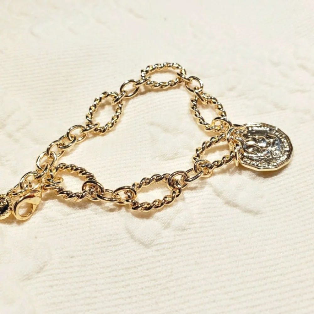 Copper twisted bracelet w/2 sided charm; NWOT